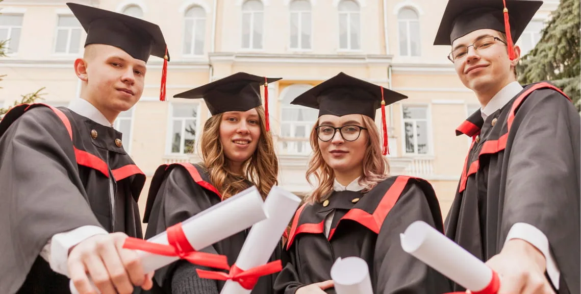 Graduating law students holding diplomas at Christ Academy Institute of Law